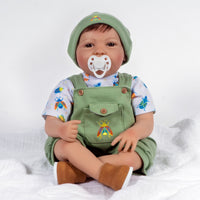 21 inch realistic toddler boy doll sculpted by doll artist Jannie de Lange. Crafted from our GentleTouch™ vinyl that gives that decadently soft and luxurious feel of real, baby-smooth skin, and comes with a weighted cloth body that features a more tapered realistic look and weighted bean bag bottom.
