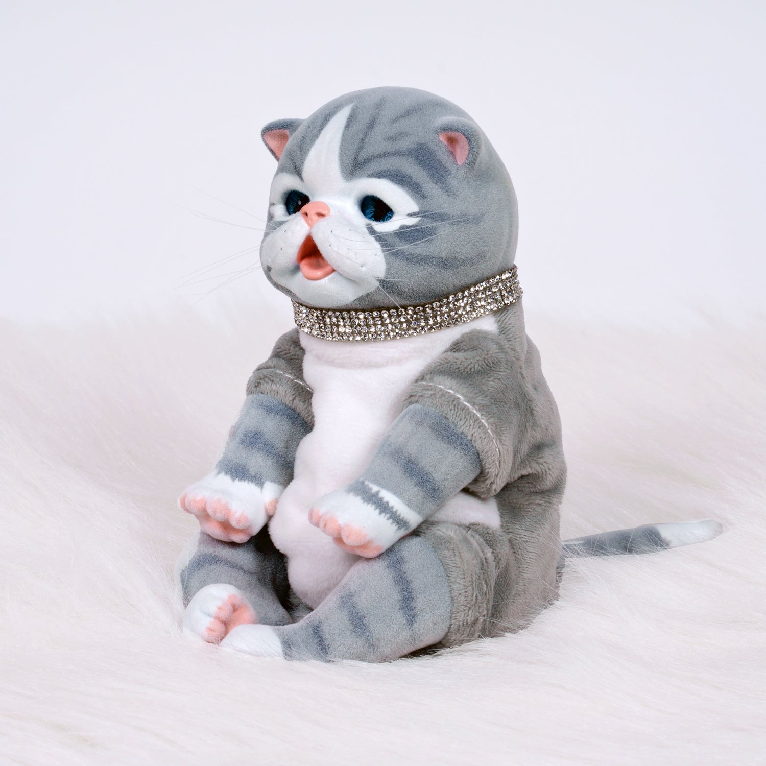 9-inch realistic Baby Tabby Kitten doll inspired by an American Shorthair kitten. Sculpted by world-renowned artist Ping Lau, the Furever Babies Kitten collection by PG is made from our premium vinyl that is flocked for a velvety finish and a weighted plush body for that wonderfully lifelike feel