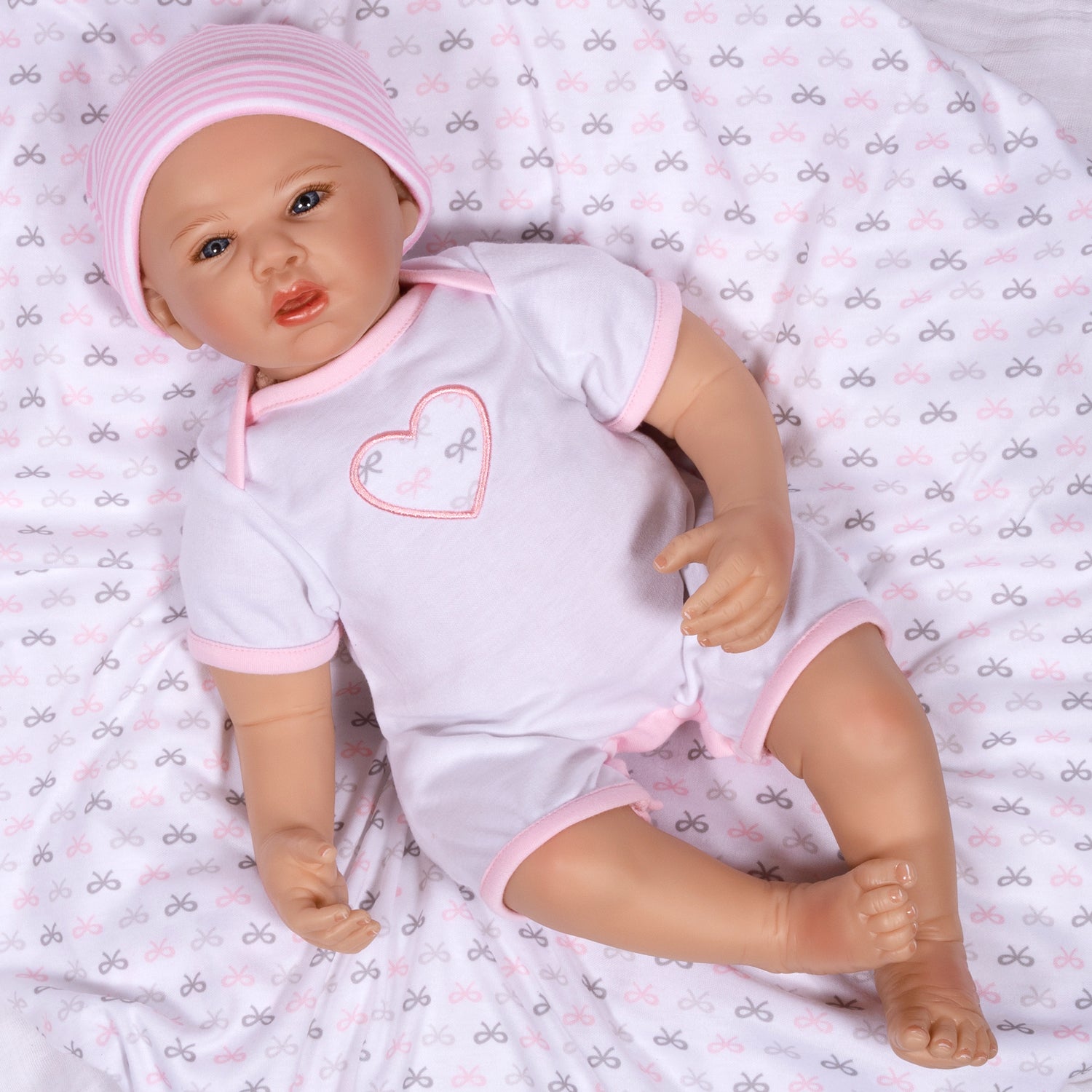 Swaddler Baby Bow Cute - 18" Realistic Doll by Reborn Artist, Michelle Fagan. Made in our exclusive SoftTouch Vinyl for an ultra-realistic feel!